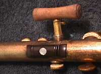 Palm crutch on a later Conn flute